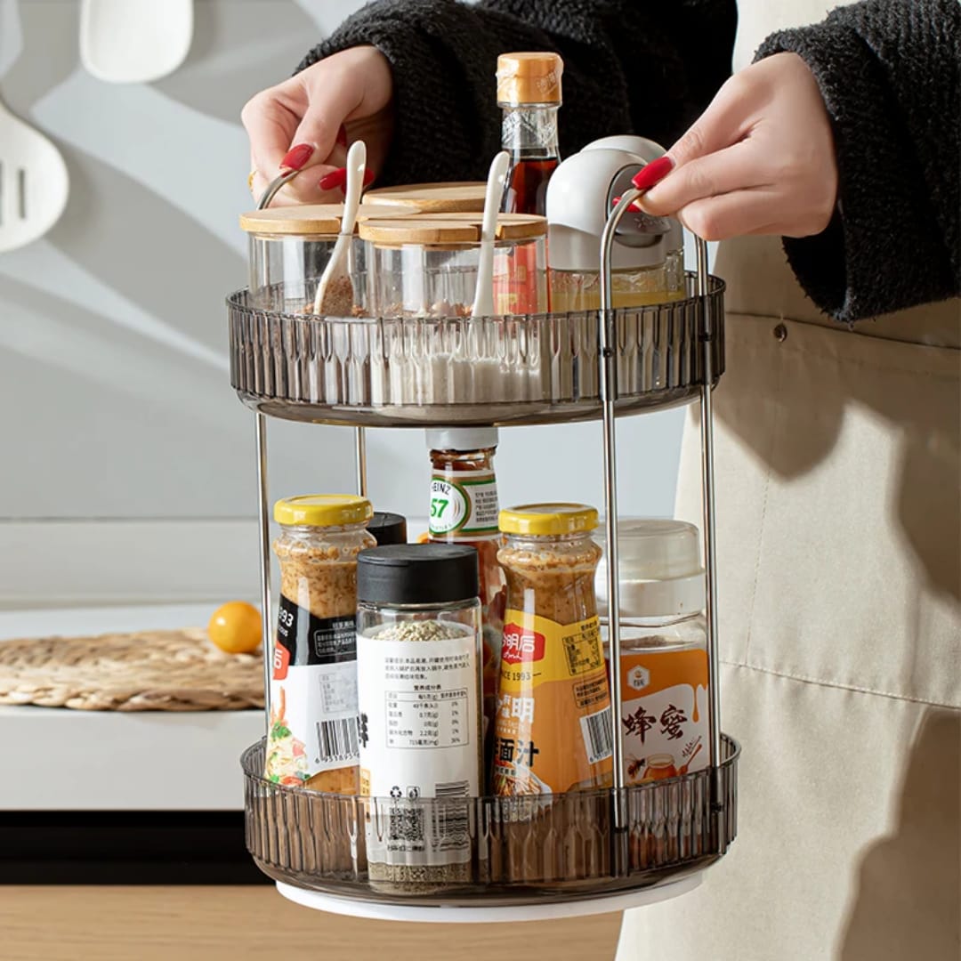 2-tier rotating makeup organizer features clear acrylic trays with stylish metallic handles