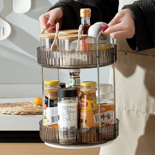 2-tier rotating makeup organizer features clear acrylic trays with stylish metallic handles