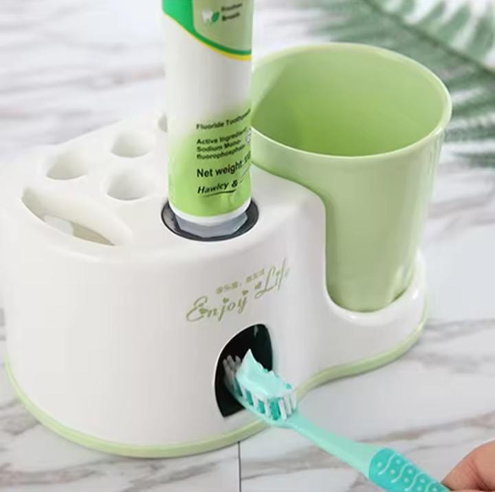 Toothbrush holder with toothpaste dispenser