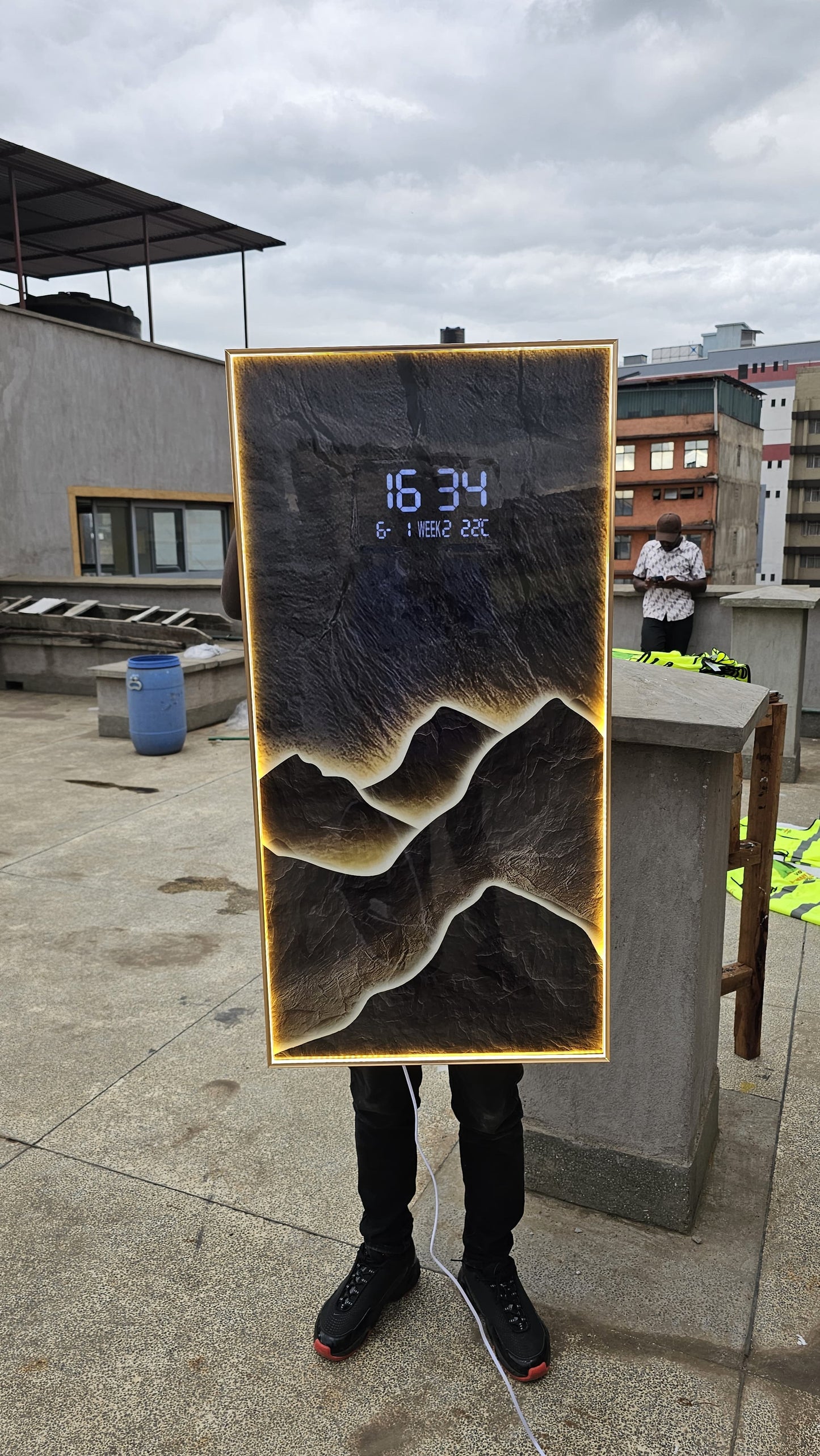Bring modern elegance to your space with this LED Decorative Wall Clock featuring a stunning layered mountain landscape design and ambient warm backlighting.
