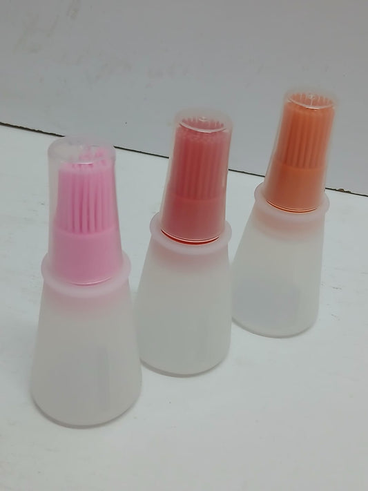 Heat resistant oil dispenser with brush