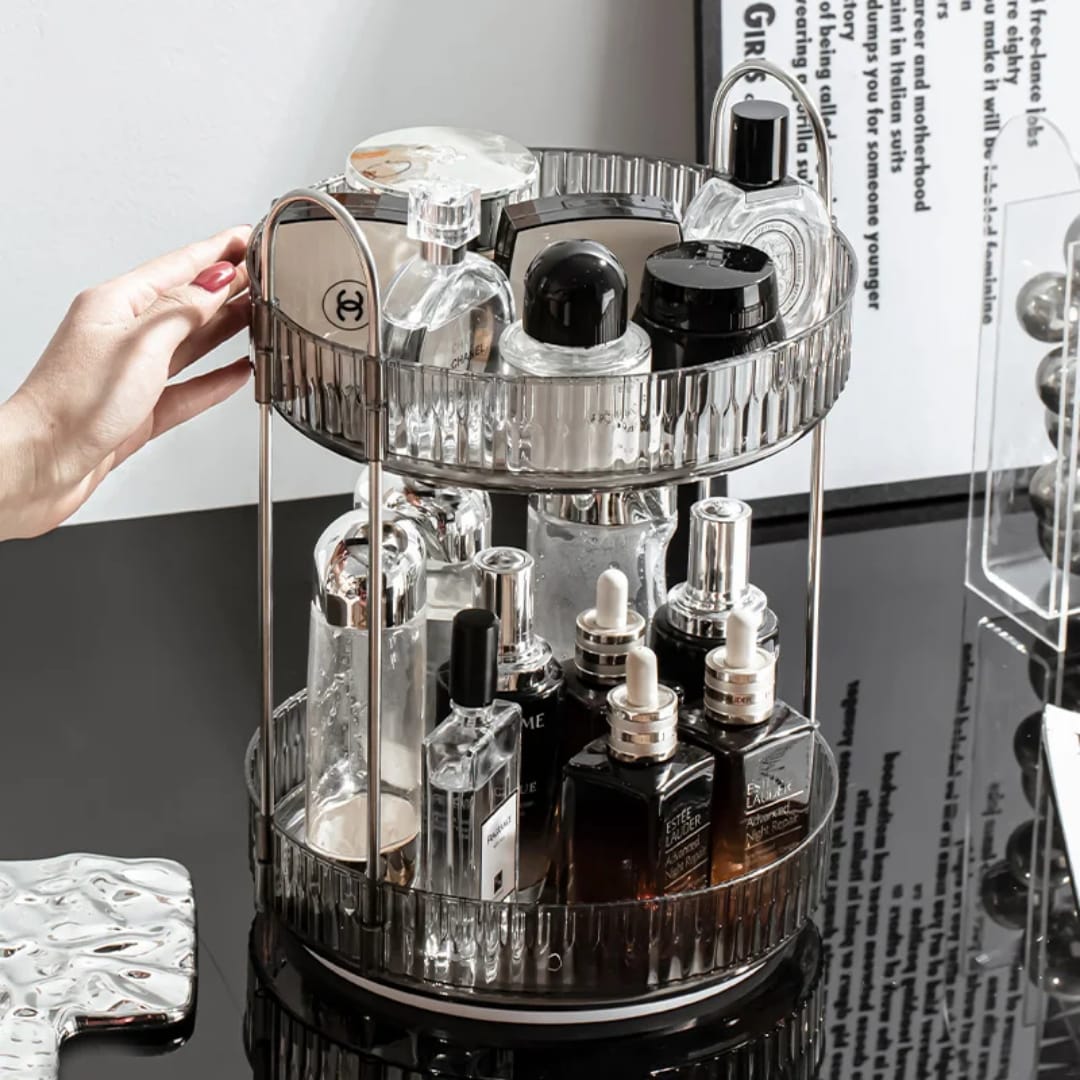 2-tier rotating makeup organizer features clear acrylic trays with stylish metallic handles