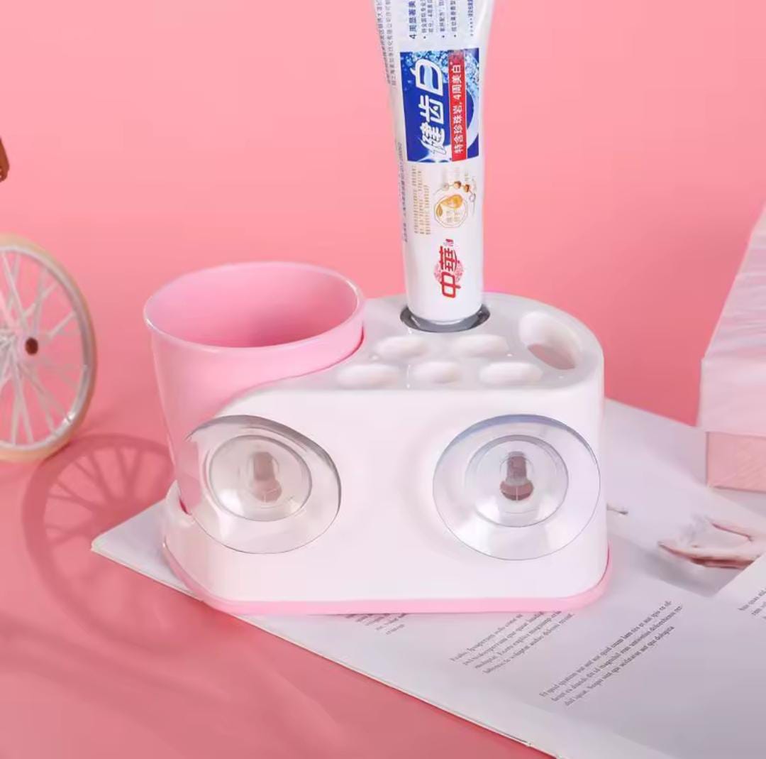 Toothbrush holder with toothpaste dispenser