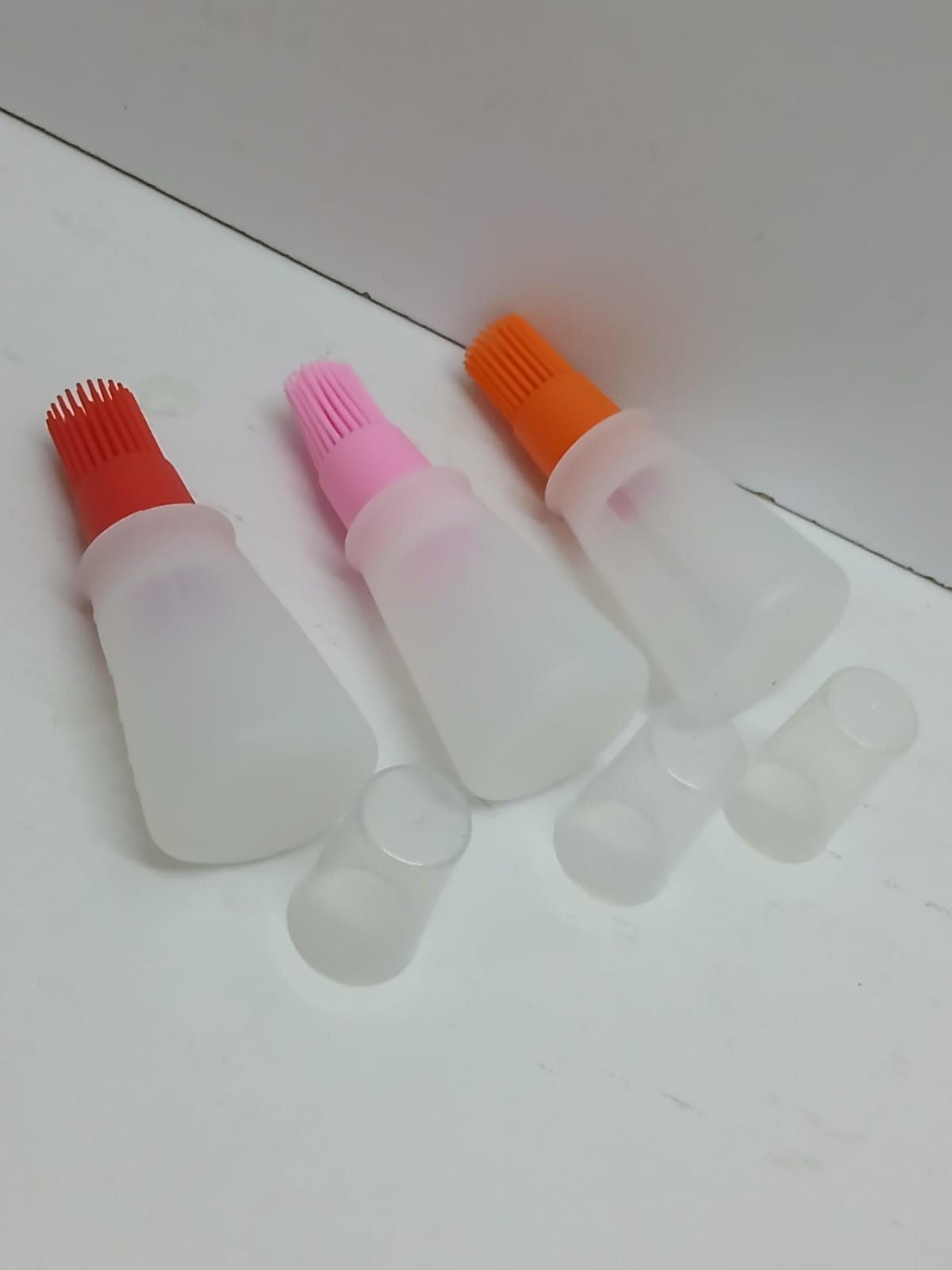 Heat resistant oil dispenser with brush