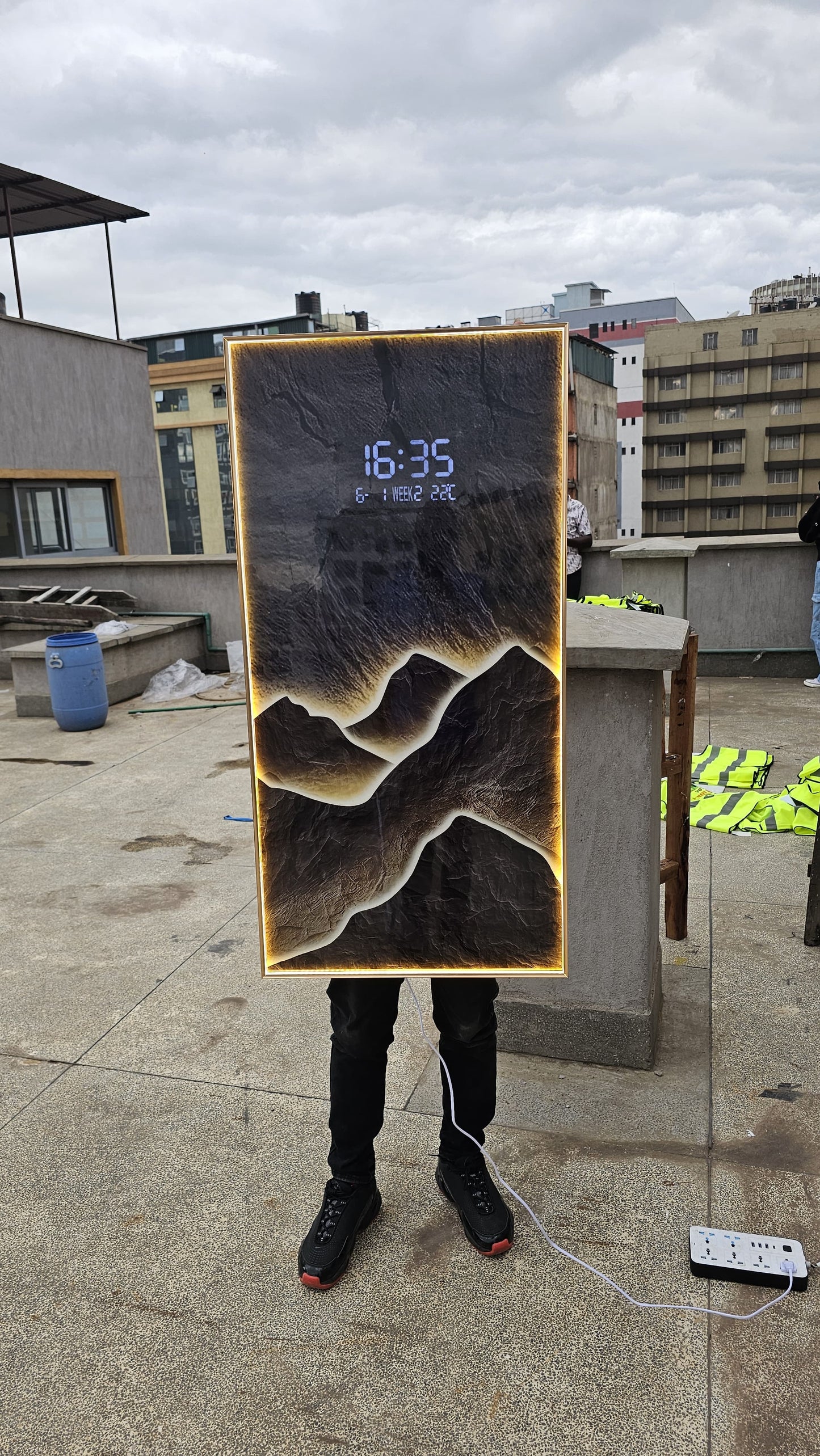 Bring modern elegance to your space with this LED Decorative Wall Clock featuring a stunning layered mountain landscape design and ambient warm backlighting.