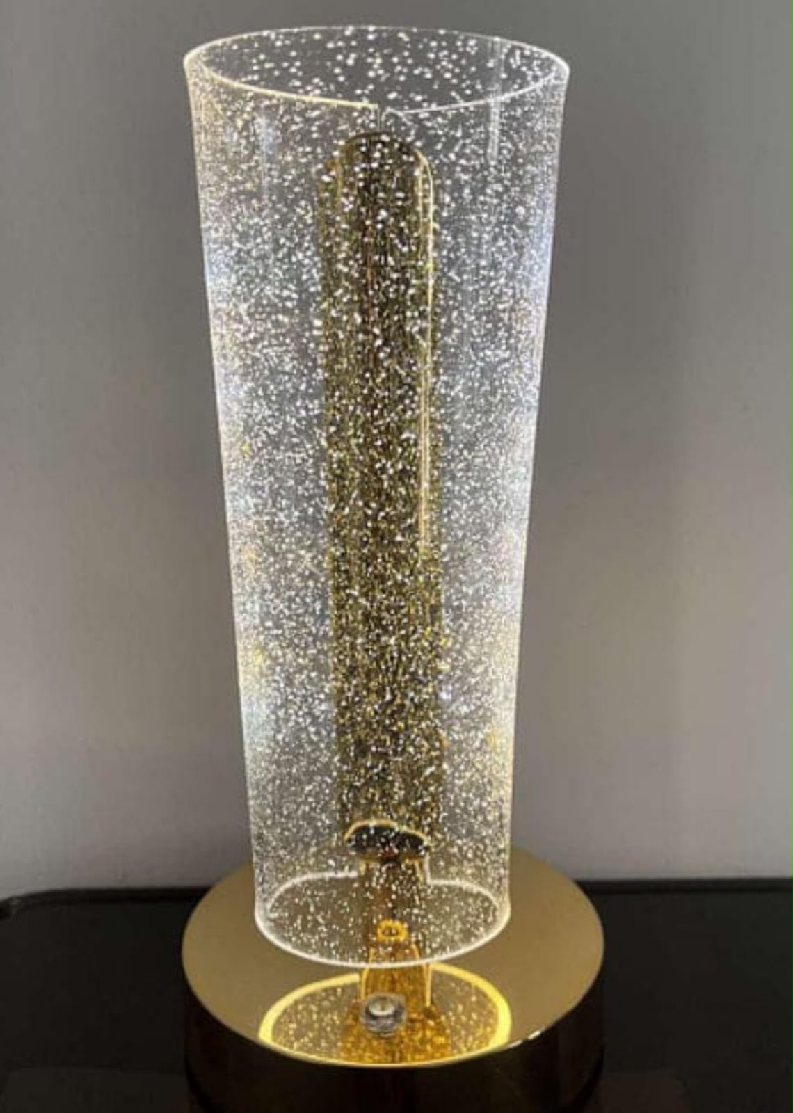 crystal table lamp golden base and a uniquely shaped acrylic shade that creates a sparkling lighting effect