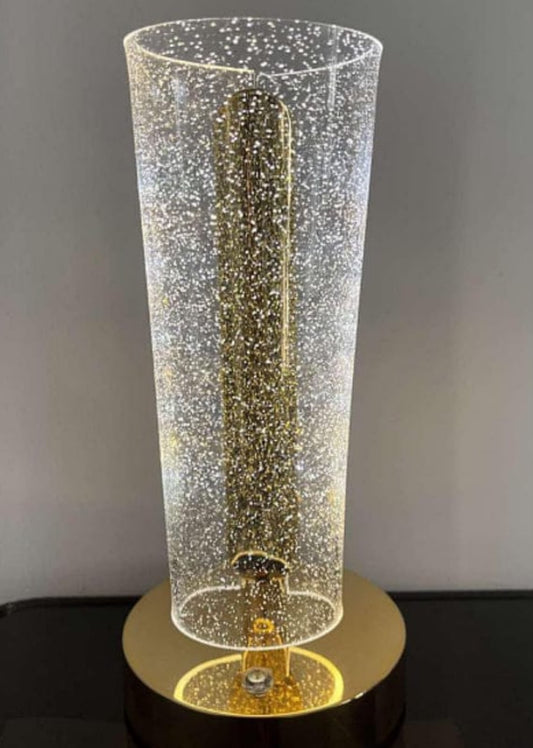 crystal table lamp golden base and a uniquely shaped acrylic shade that creates a sparkling lighting effect