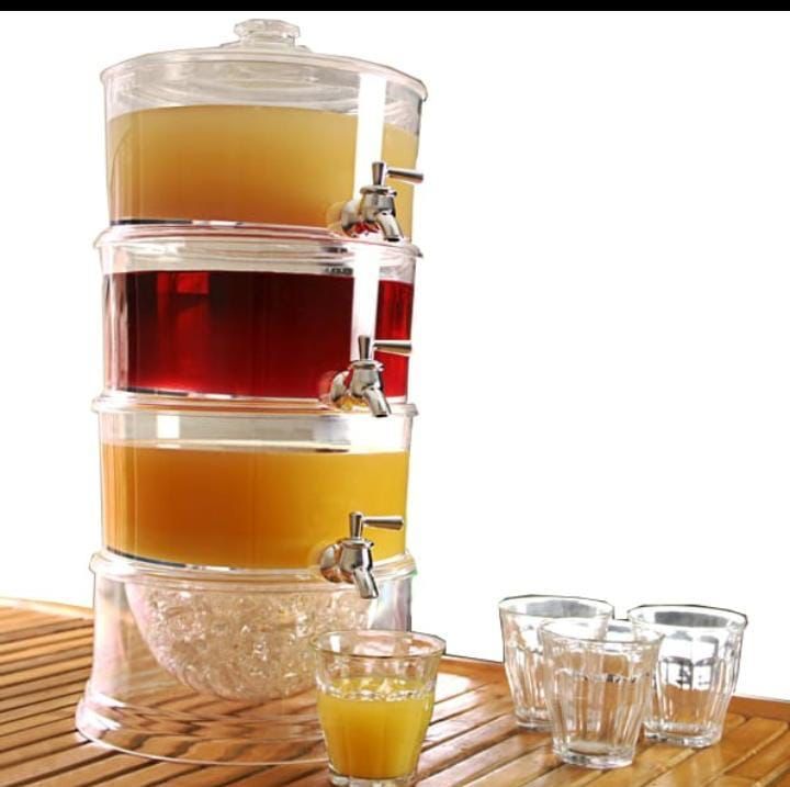 Juice/beverage dispenser with dispensing taps