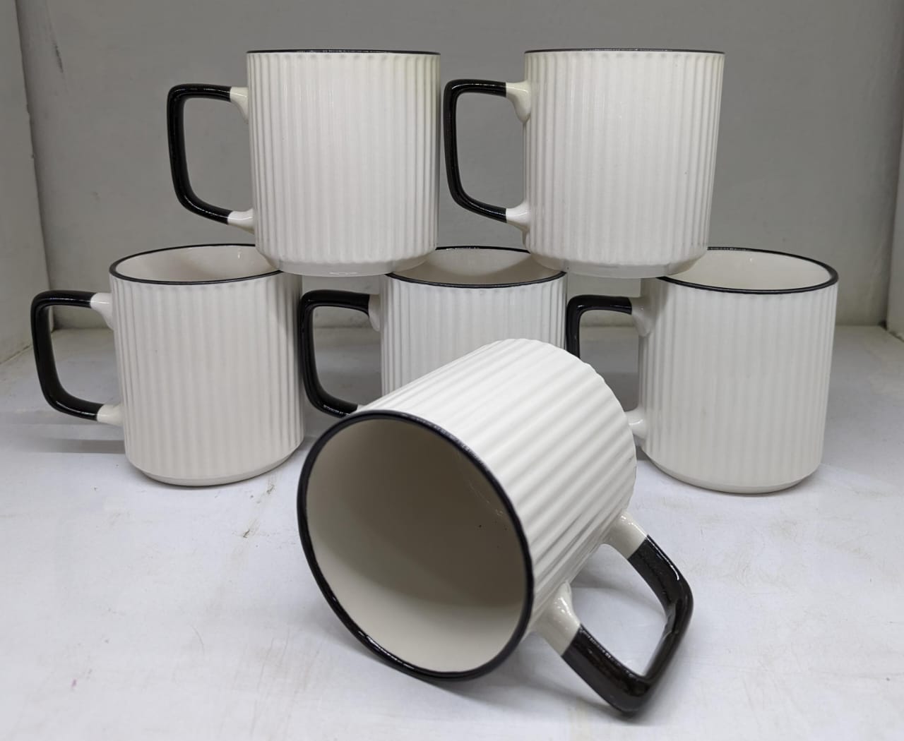 White and black ceramic cups
