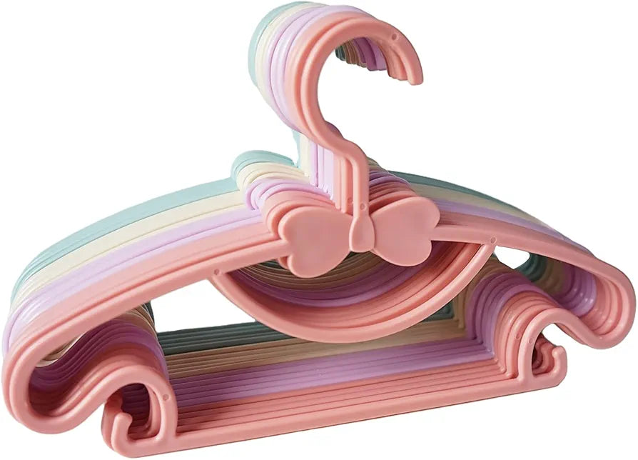 Pastel-colored plastic kids clothes hangers.