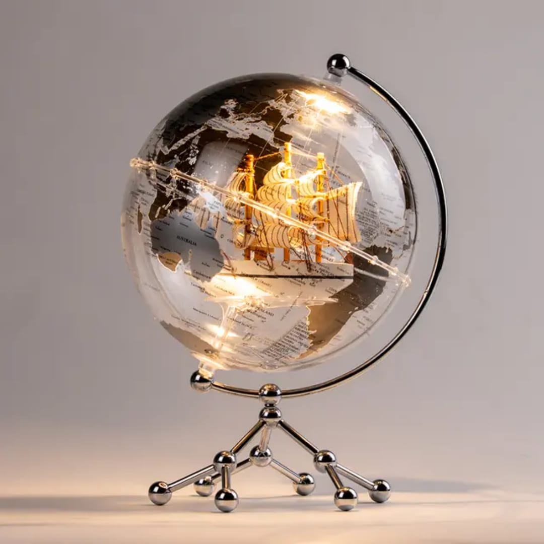 Illuminating LED world globe ornament with metal stand