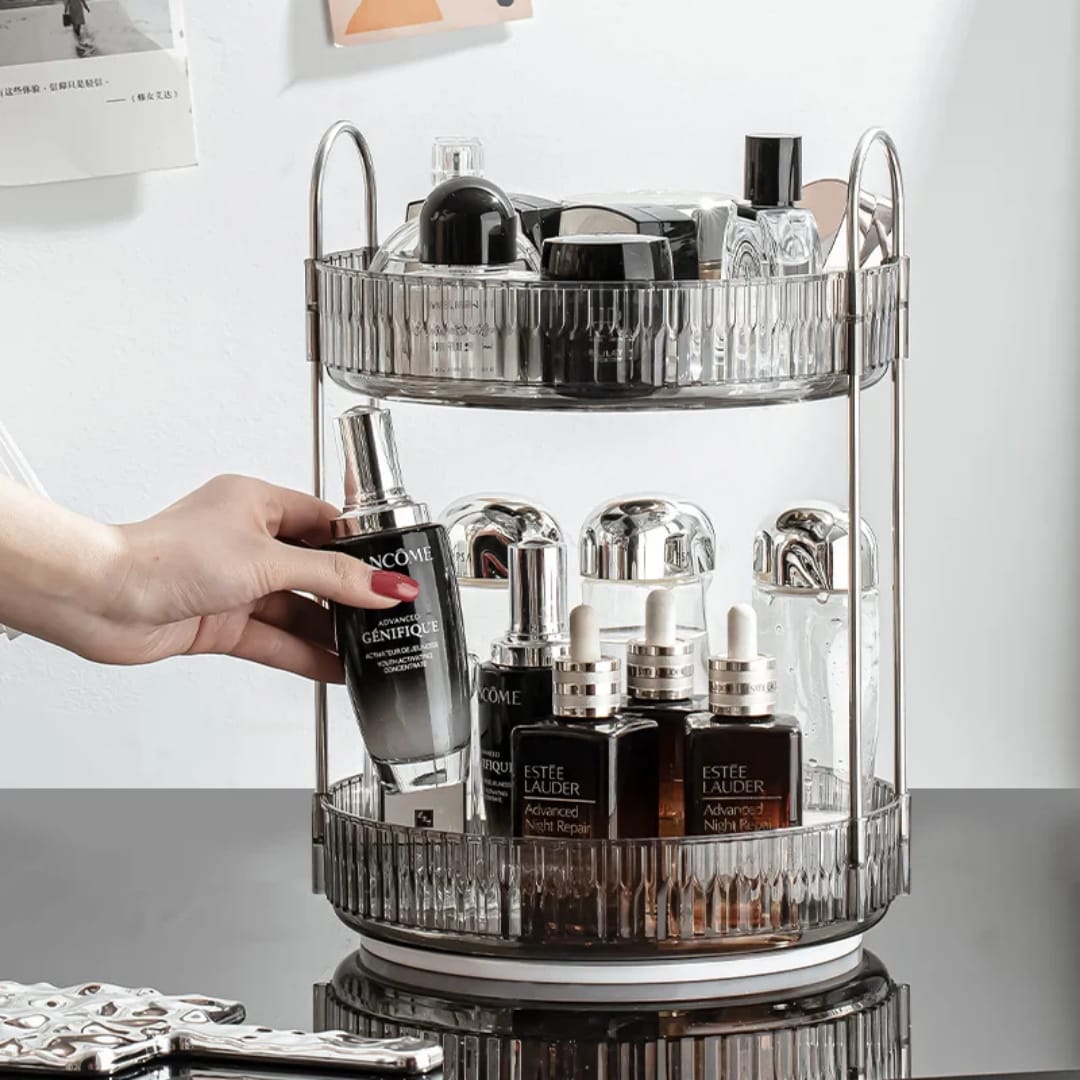 2-tier rotating makeup organizer features clear acrylic trays with stylish metallic handles